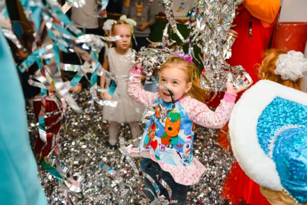 photo of girl having fun in birthday party
